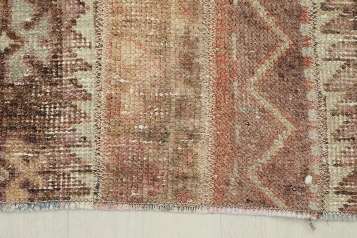 Close-up view of the low wool pile and the hand-knotted texture of the rug