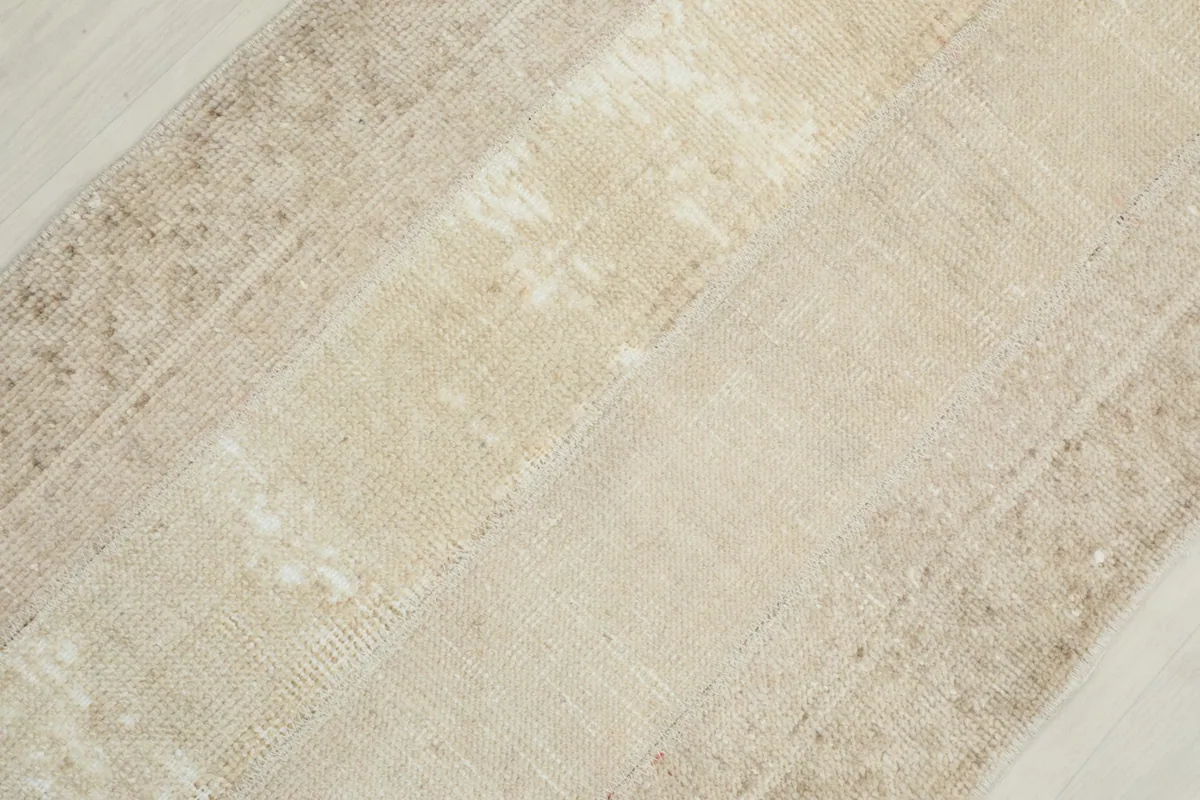 Diagonal close-up of the runner, emphasizing the variations in pile and color.