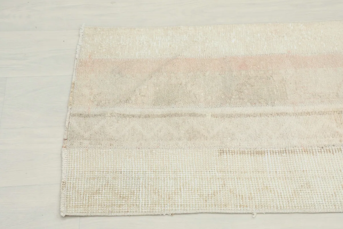 View of the back of the vintage Anatolian rug, showing the cotton foundation and hand-knotted construction