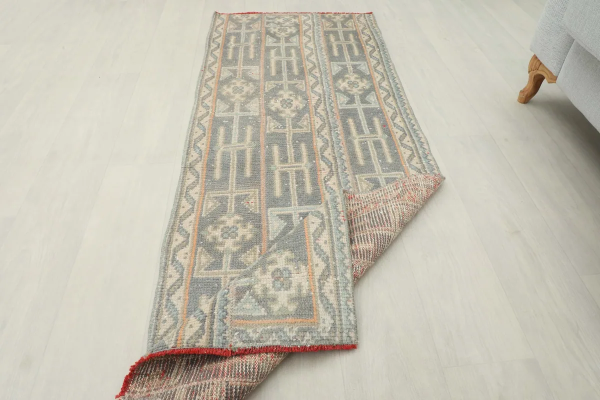 Runner partially folded, revealing the reverse side texture and construction