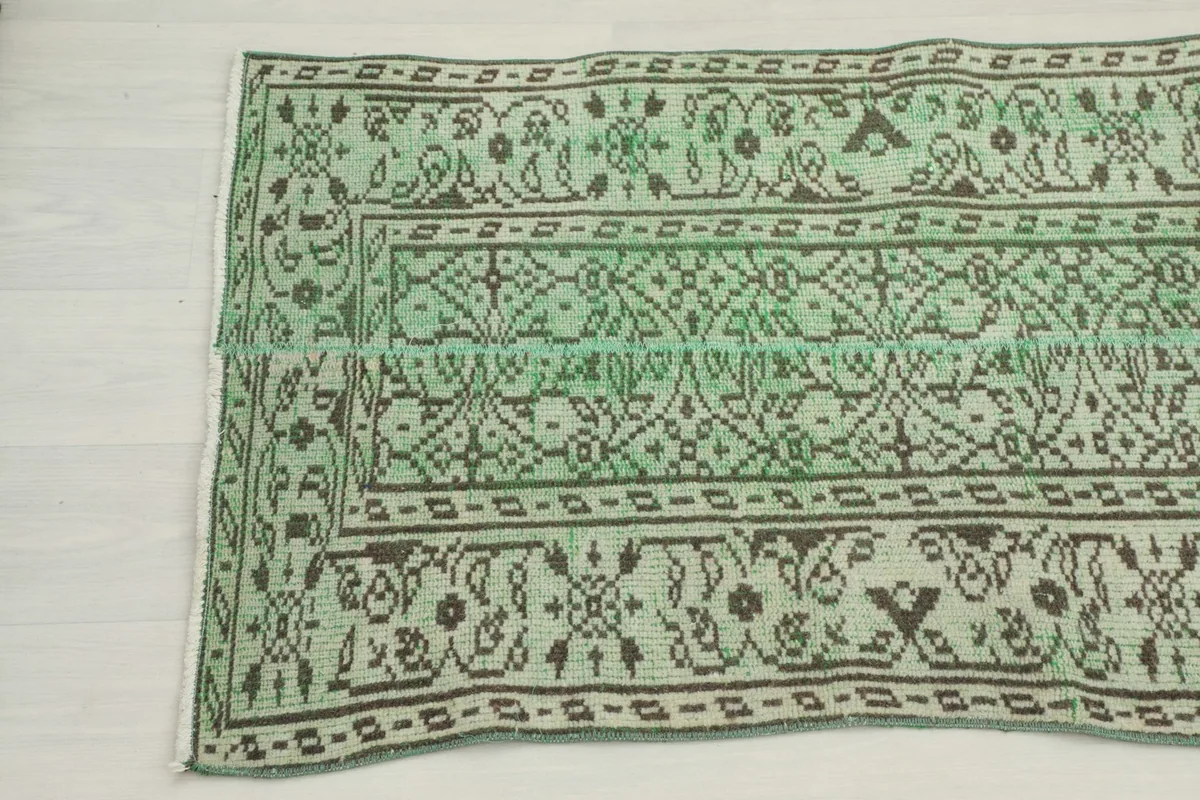 Another close-up of the runner rug's pattern, highlighting the border and field design