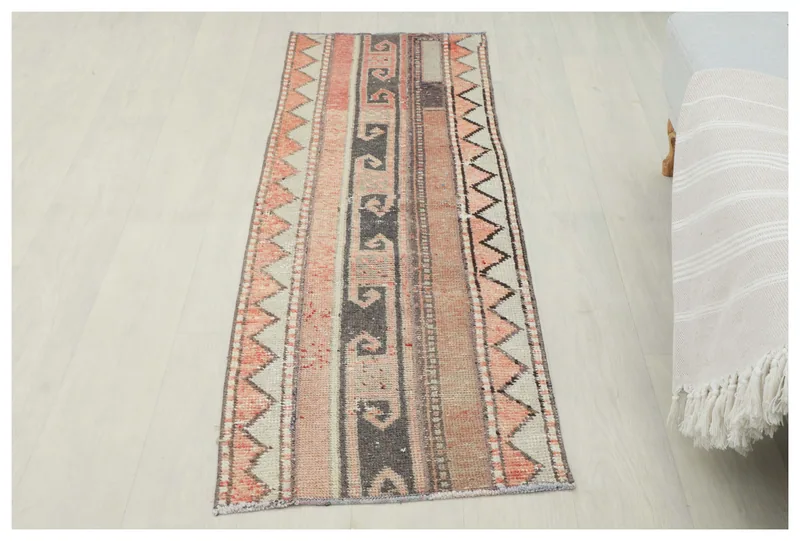 Full top view of the 1'9" x 5'4" vintage Anatolian runner rug with rust, gray, and black geometric patterns.