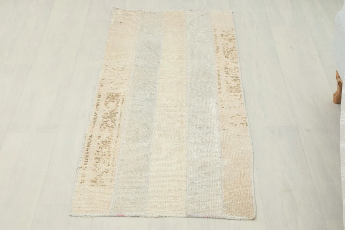 Vintage beige and gray patchwork area rug from Anatolia