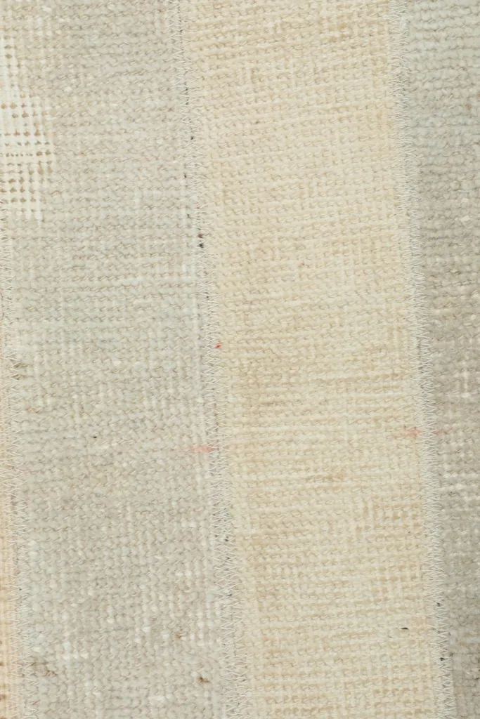 Close-up of the rug's cotton foundation from the backside
