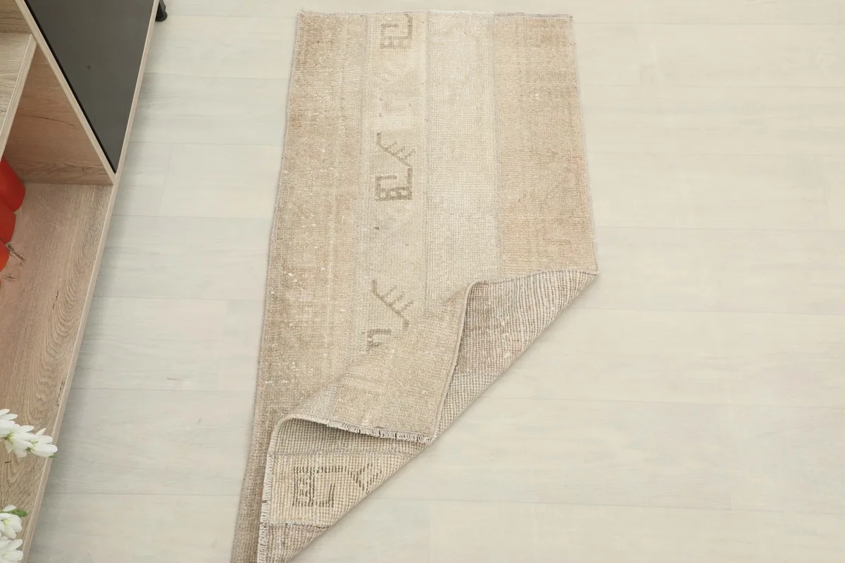 Rug partially folded, illustrating its flexibility and thickness