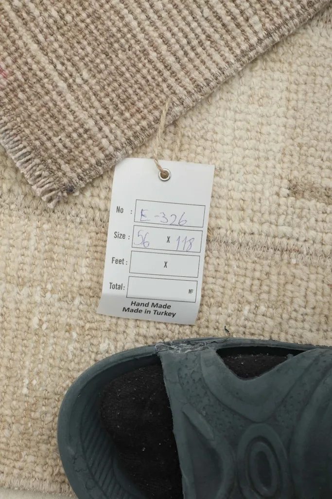 Size tag with dimensions and 'Hand Made in Turkey' next to a shoe for scale