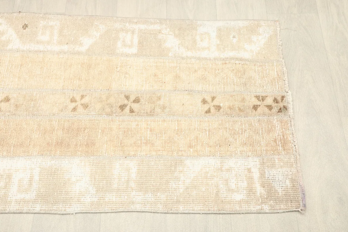 Opposite corner view of the rug, showing the tribal elements along the edge