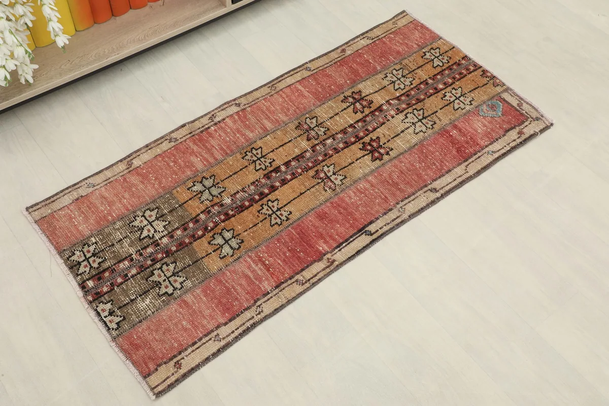 Angled overhead view showcasing the full length and geometric striped pattern of the rug