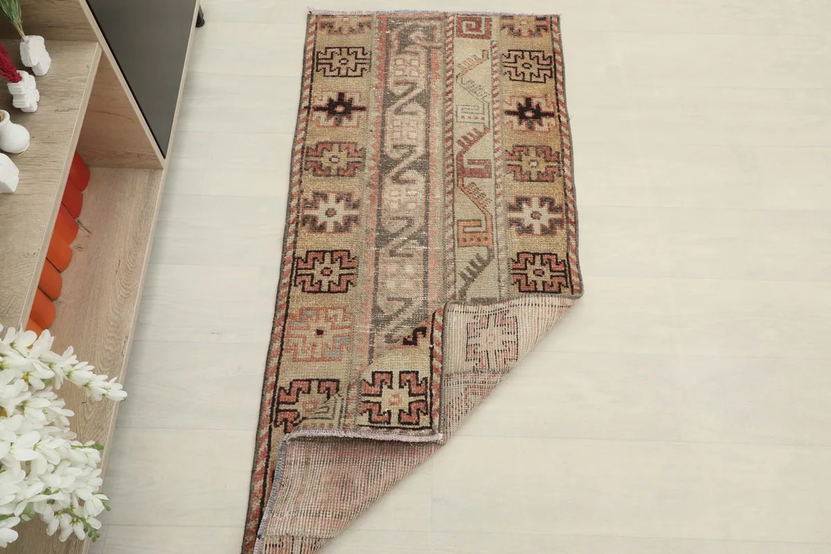 The rug partially folded, showing its flexibility and the reverse side with subtle color variations.