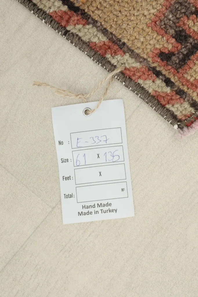 Product tag attached to the rug, displaying item number, size in centimeters, and 'Hand Made Made in Turkey'.