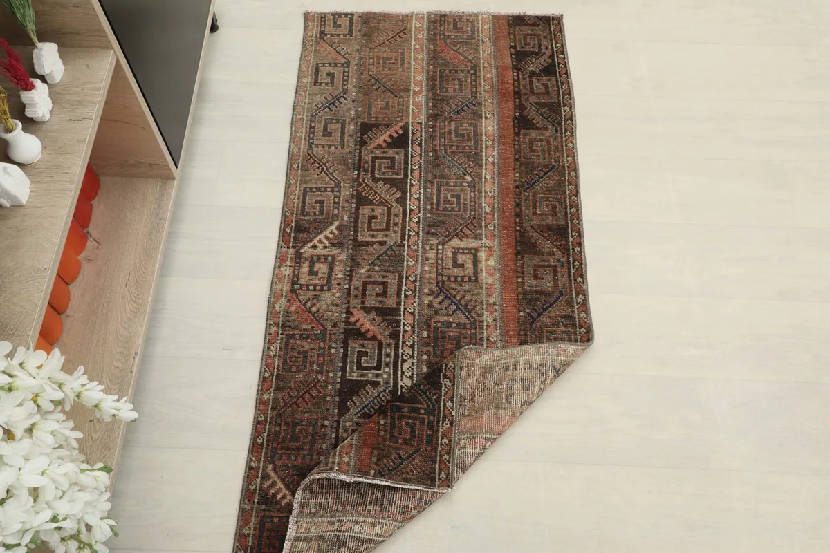 The rug partially folded, showing the thickness of the material and overall condition.