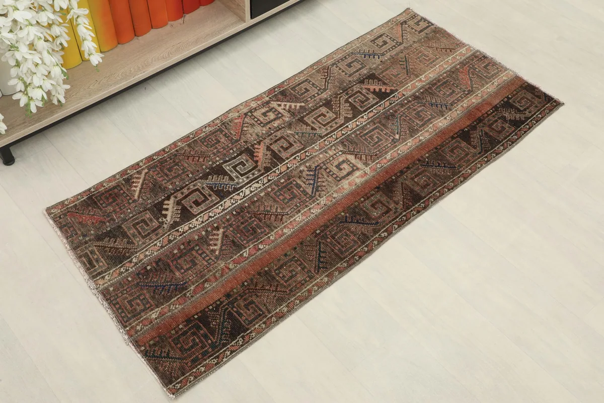 Overhead shot of the vintage Anatolian rug, highlighting its striped pattern and rich colors.