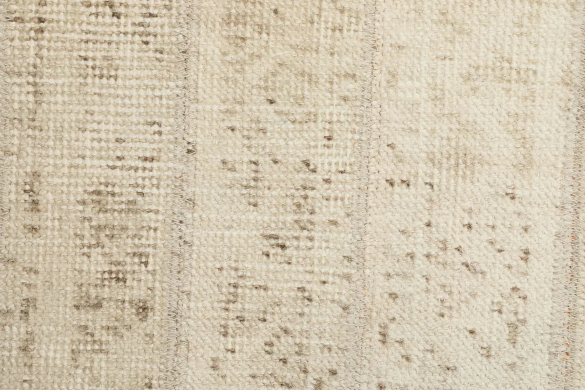 Close-up of the rug's central field, highlighting the subtle variations in color and pattern.