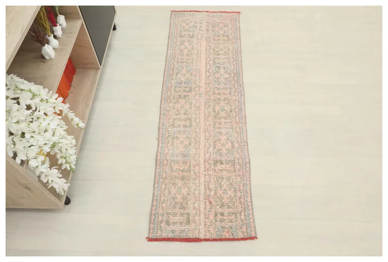 Full overhead view of the 1'7" x 5'4" vintage Anatolian runner rug on a white background.