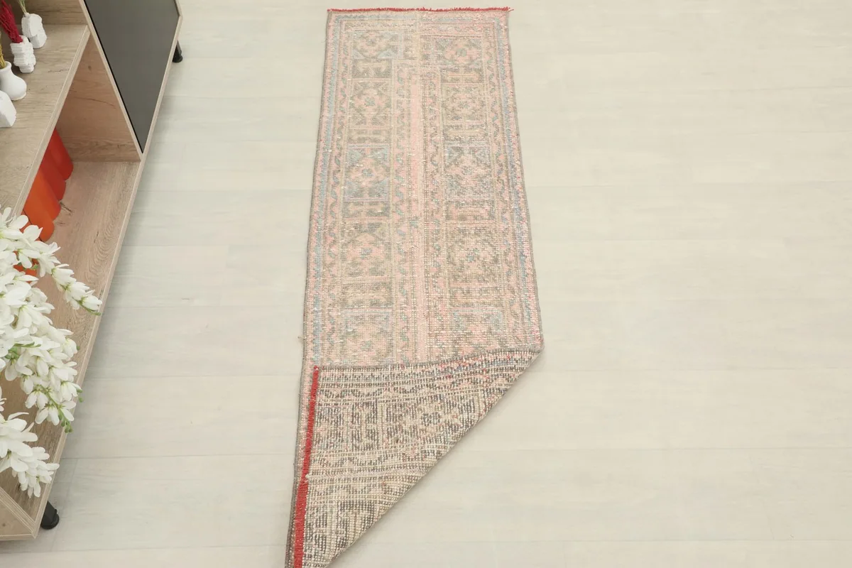 The runner folded to display both the front pile and the sturdy cotton foundation.