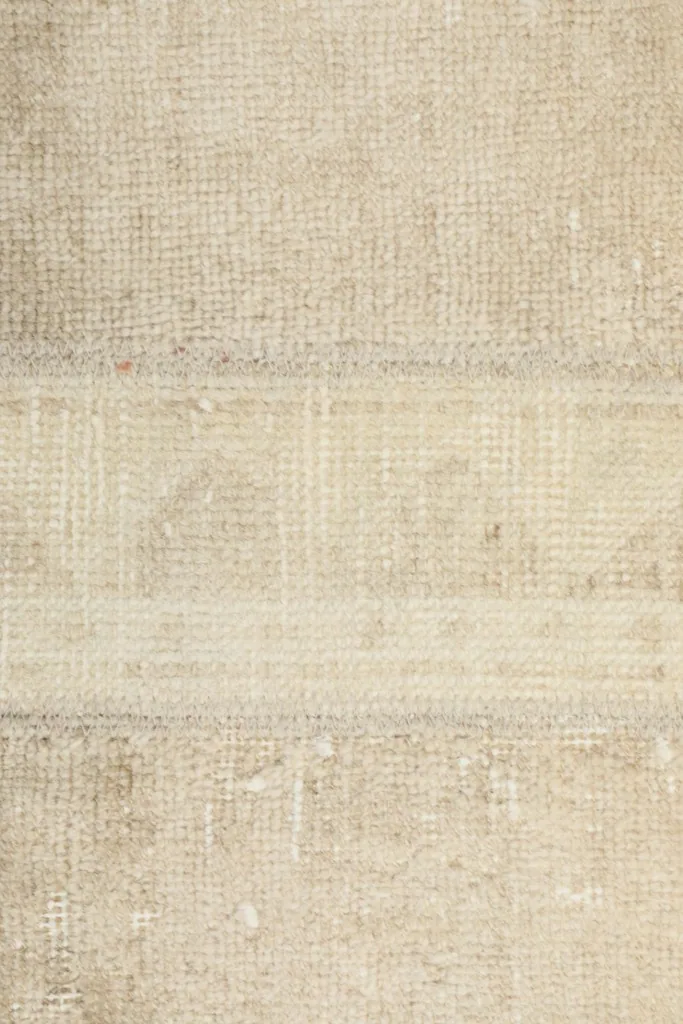 Detailed view of the low pile and texture of the hand-knotted wool on this Anatolian rug.