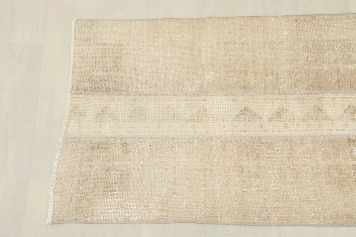 Overhead view showing the other end of the vintage Anatolian runner with its soft colors.