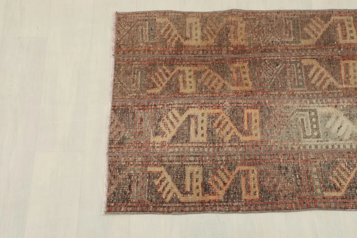 Overhead view of the other end of the rug, showing the consistent geometric design across the width