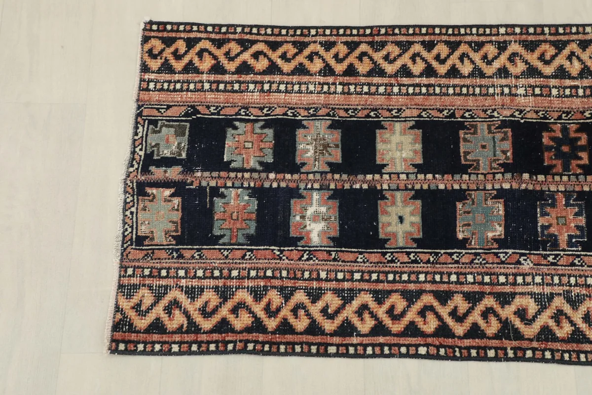 Overhead view of the opposite end of the runner rug, showing consistent patterns and colors.