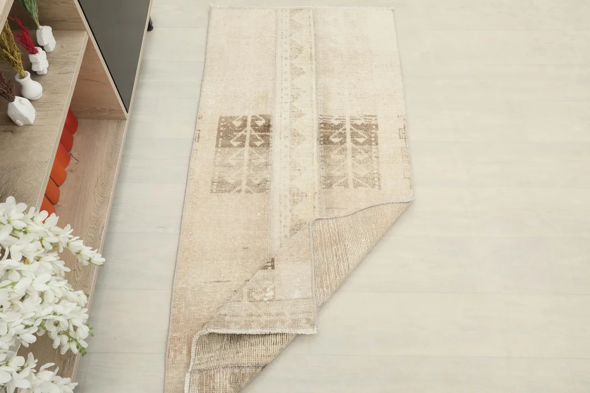 The rug partially folded, illustrating its flexibility and thickness.