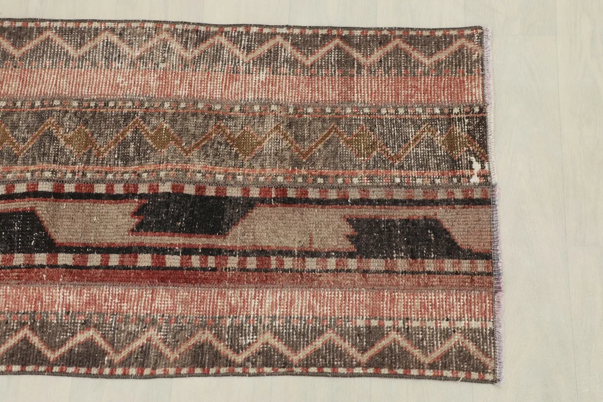 Overhead view of the rug's width, showcasing its full geometric and striped design from above.