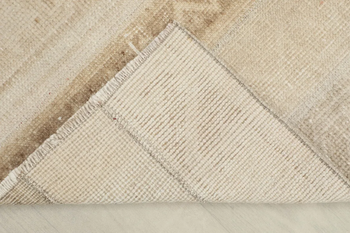View of the reverse side of the rug, showing the cotton foundation and tight hand-knotting.