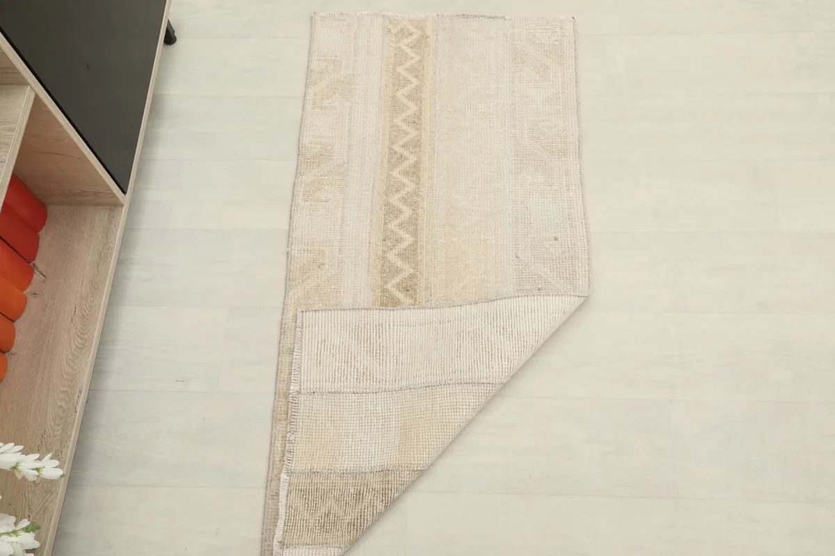 The vintage runner folded to show its flexibility and thickness.