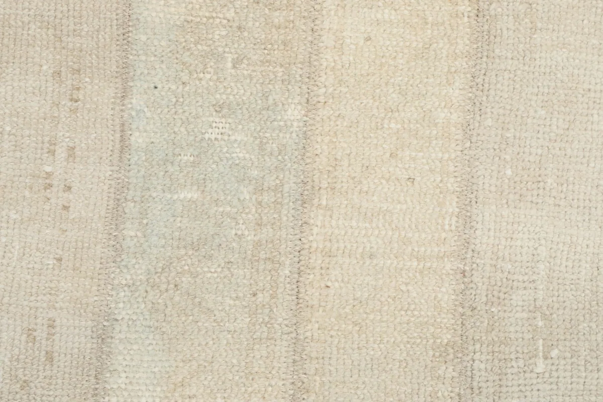 Close-up of the low wool pile and hand-knotted texture of the rug.