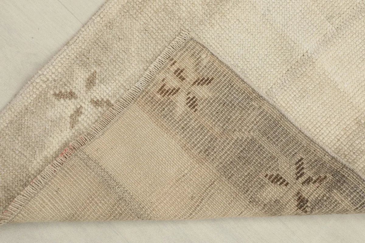 View of the back of the hand-knotted runner, showing the cotton foundation and knotting.