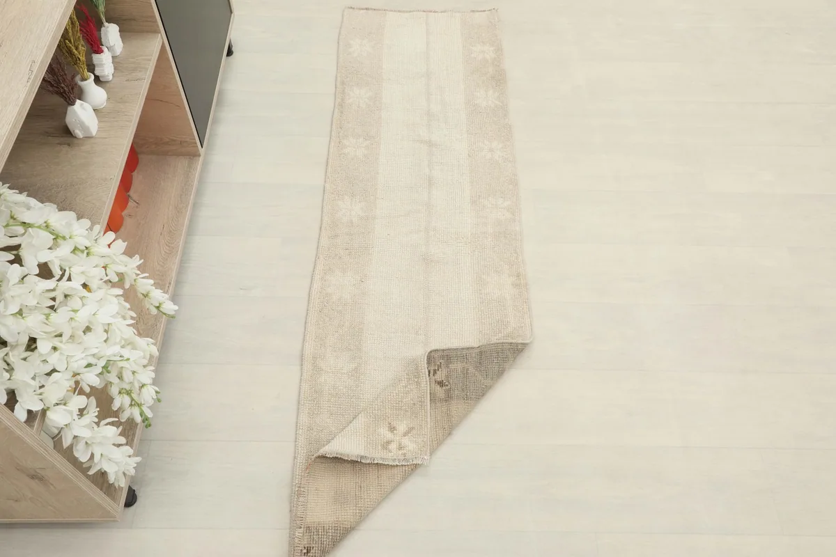 Runner partially folded, demonstrating its flexibility and showing both front and back.