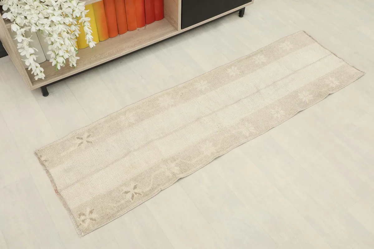 Overhead view of the vintage Anatolian runner, showcasing its full length and subtle patterns.