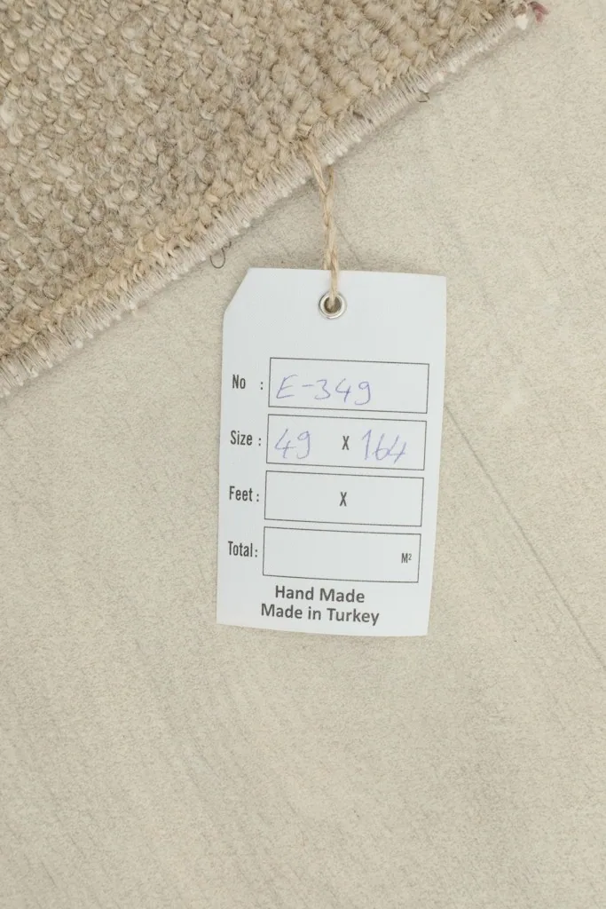 Tag showing the rug's dimensions and origin as hand-made in Turkey.