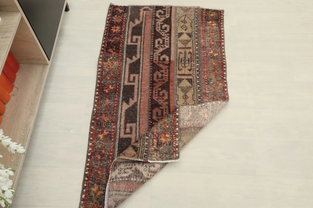Rug partially folded, displaying both the pile and the reverse side