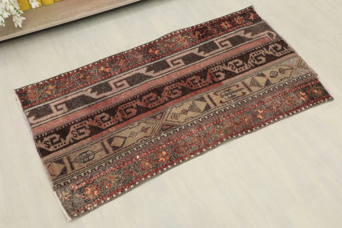 Slightly angled overhead view showcasing the striped pattern and colors of the rug