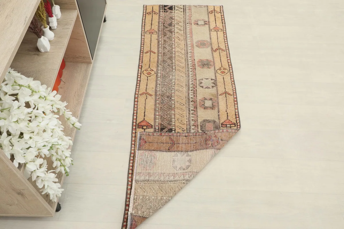Runner partially unrolled in a room setting, showing its scale and aesthetic