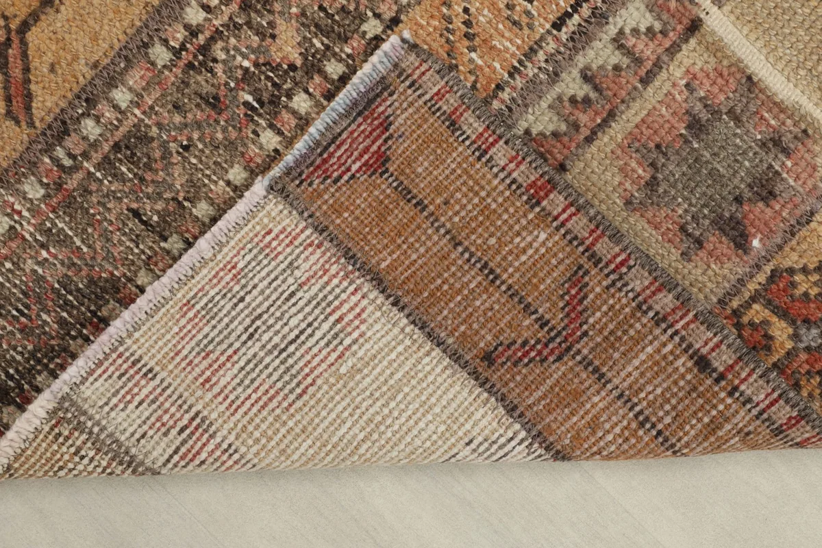 View of the back of the hand-knotted wool runner, revealing its construction