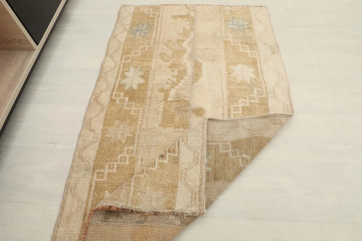 The rug folded to show its flexibility and thickness, highlighting the pile texture.