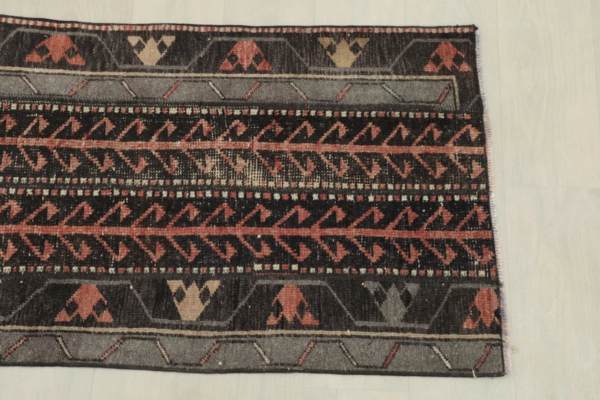 Close-up of the rug's patterns and colors from one end