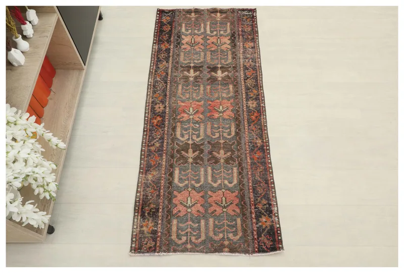 Full top view of the charcoal and rose tribal hand-knotted vintage Anatolian wool rug