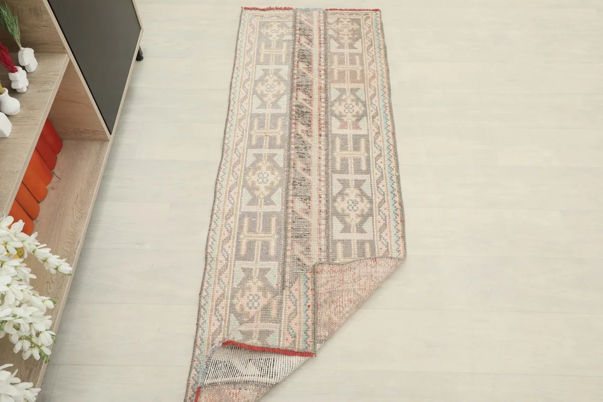 The runner partially folded, showcasing its flexibility and the reverse side of the weave