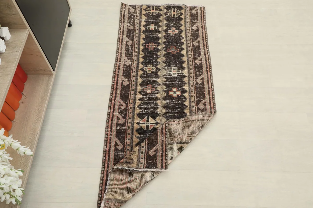 The runner rug folded to show its flexibility and thickness