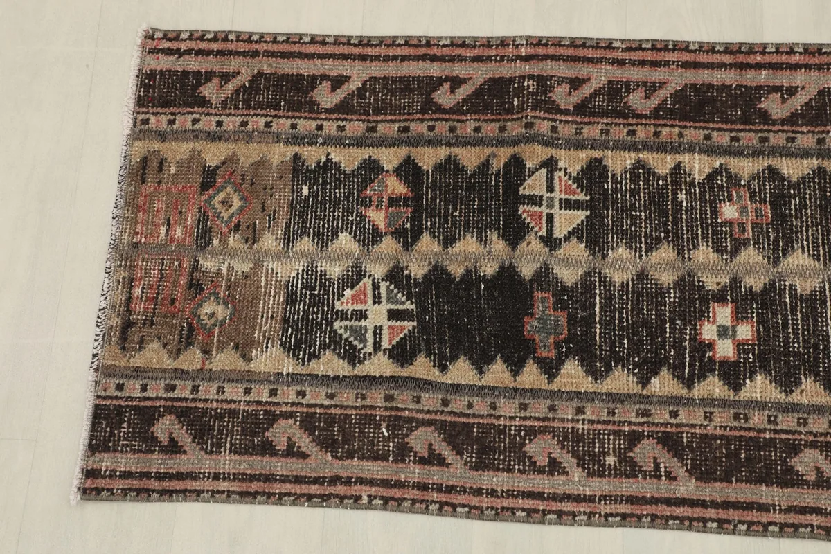 Overhead view showing the bottom half of the runner rug and its tribal design