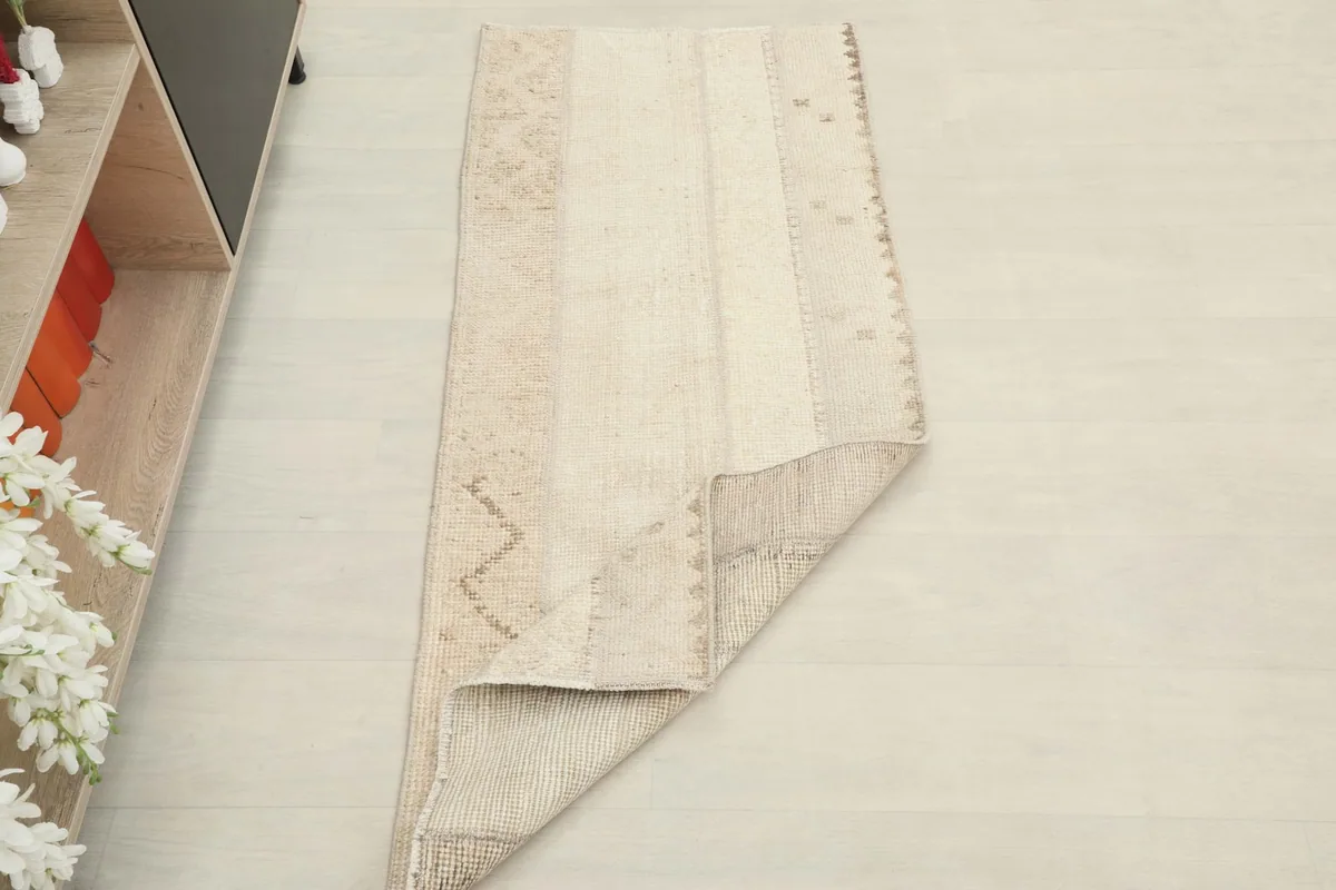 Rug placed in a room setting, showing its scale and appearance near furniture