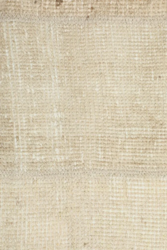 Detailed view of the low wool pile texture on the vintage Anatolian rug