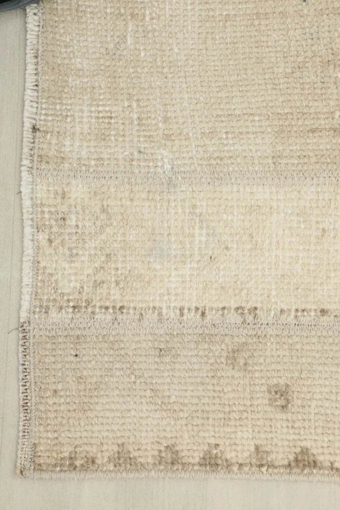 Underside view showing the cotton foundation and hand-knotted construction