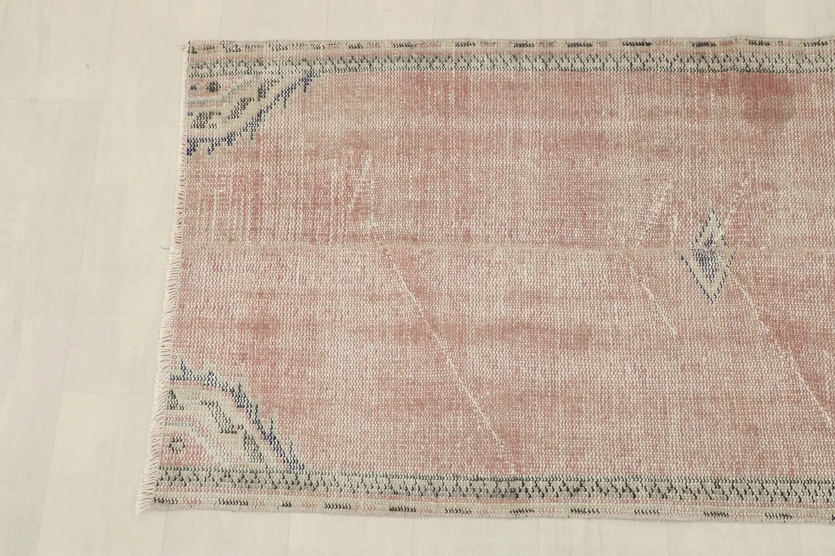 Overhead view of the other half of the rug, detailing the border and subtle field patterns