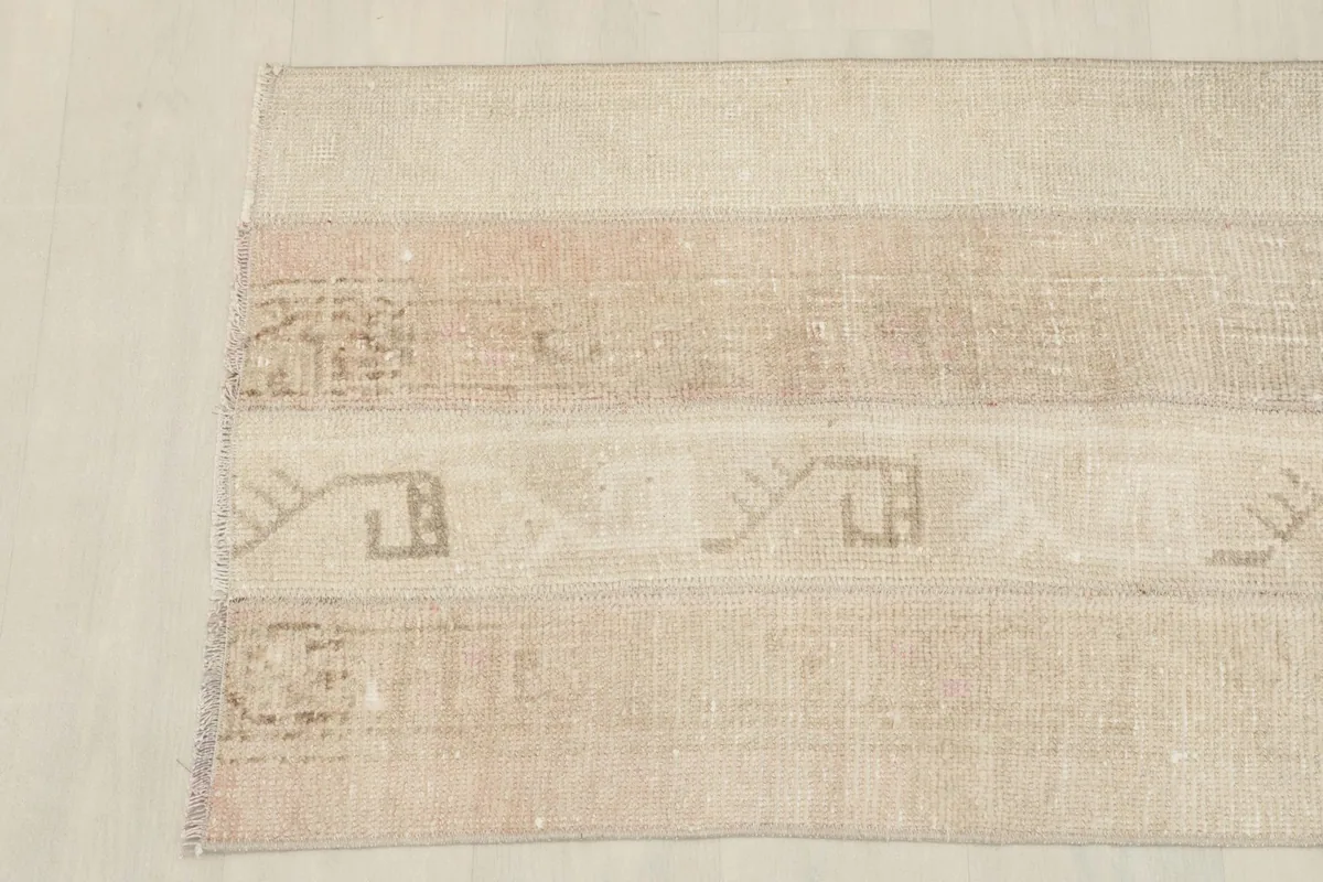 Overhead view of the other end of the rug, showing the consistent patchwork pattern and slight variations