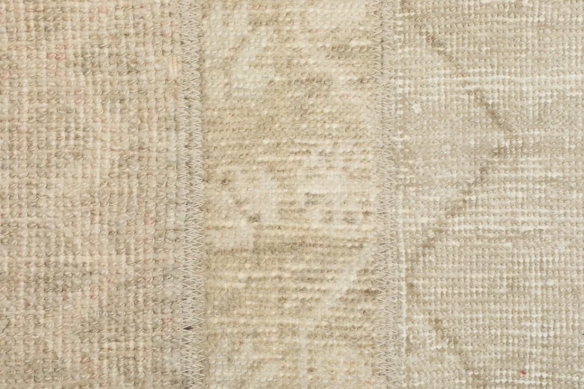 Close-up of the rug's central sections, revealing the subtle variations in color and weave