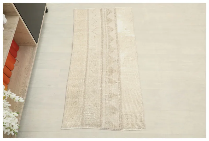 Full top view of the 2x4 beige vintage Anatolian rug with subtle geometric patterns