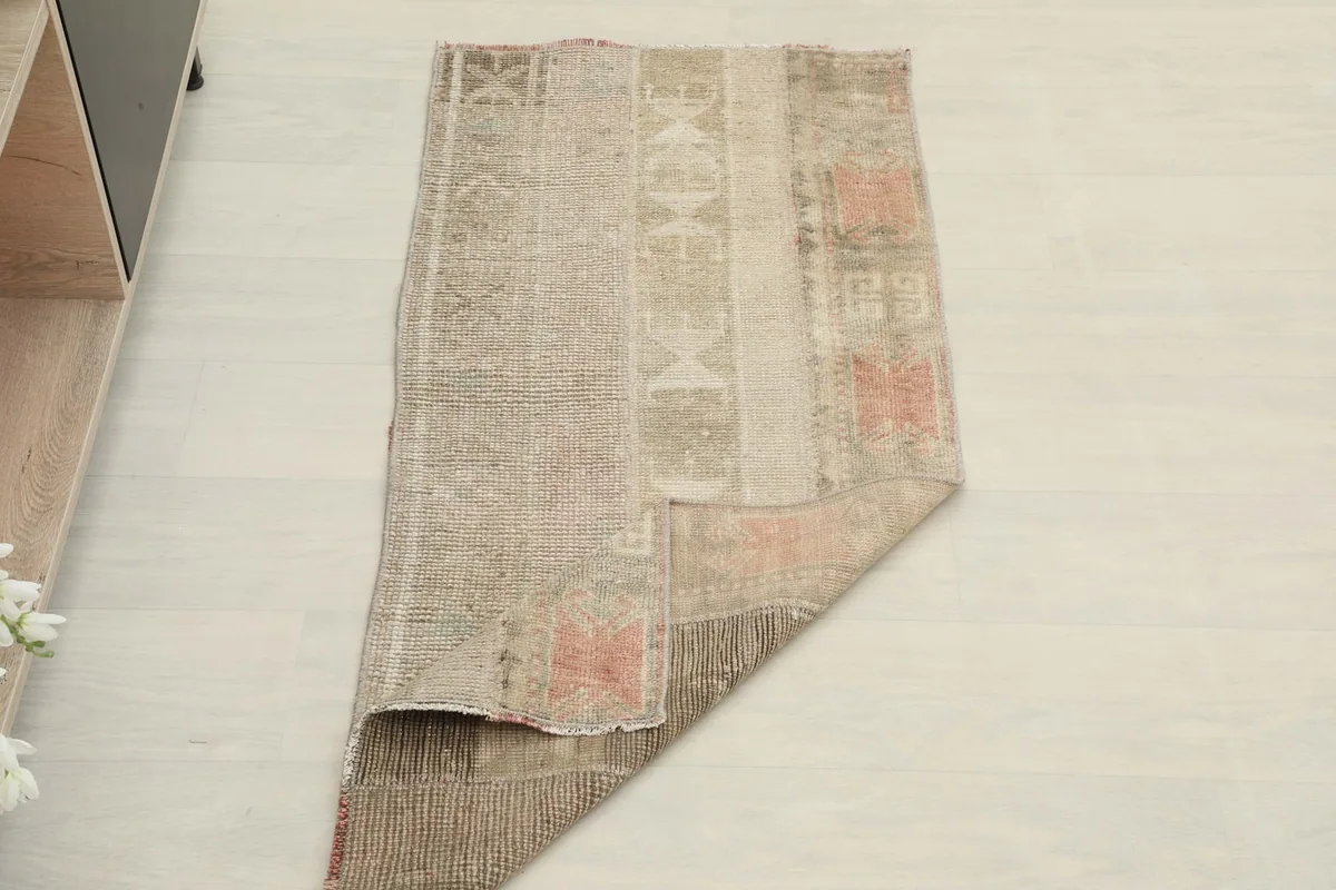 The rug partially folded, showcasing its flexibility and the overall design from a different perspective.